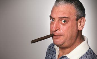 headshot of Rodney Dangerfield smoking a cigar