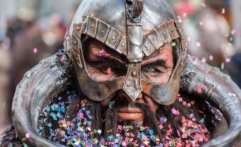 Man in traditional armour with confetti in his beard