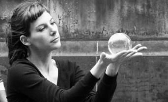 woman holding crystal sphere