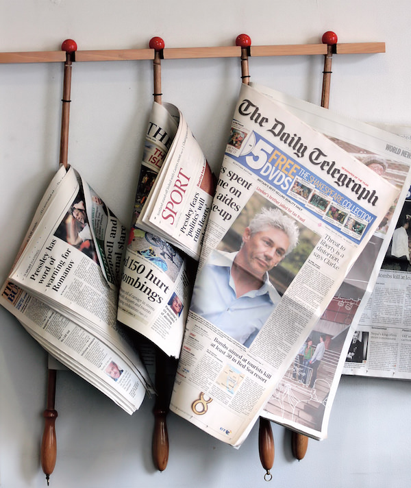 newspapers on a rack