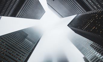 Looking up towards skyscrapers