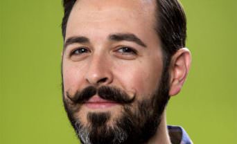 Head shot of Rand Fishkin with a green background