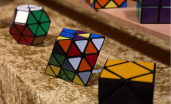 three rubix cubes in a row